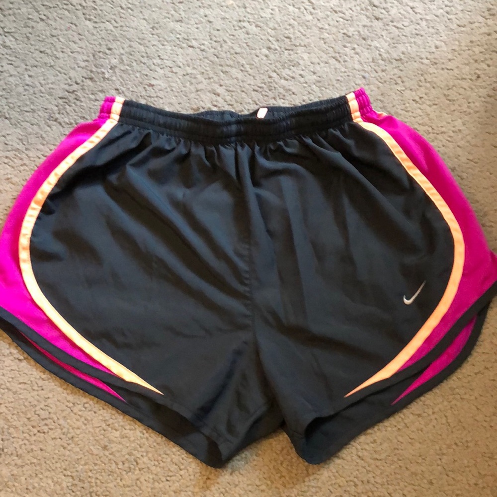 Dark grey with neon orange and fuchsia accents.